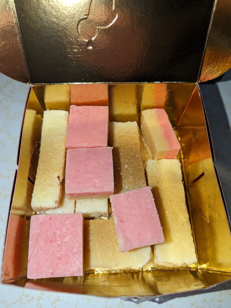 A box of pink and white barfi