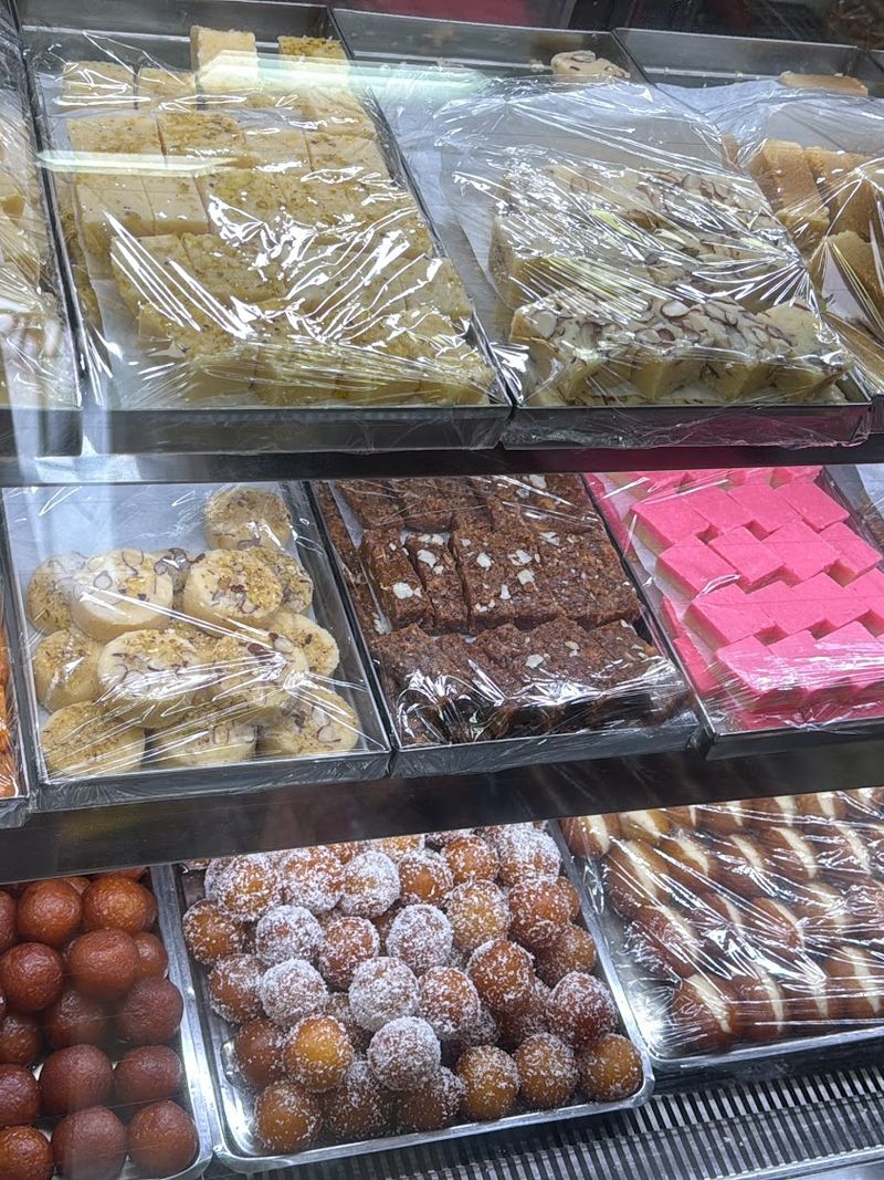 Trays of barfi, gulab jamun and coconut ladoo