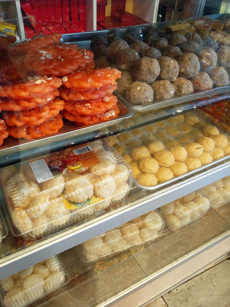 Rasgulla and jalebi in the display case